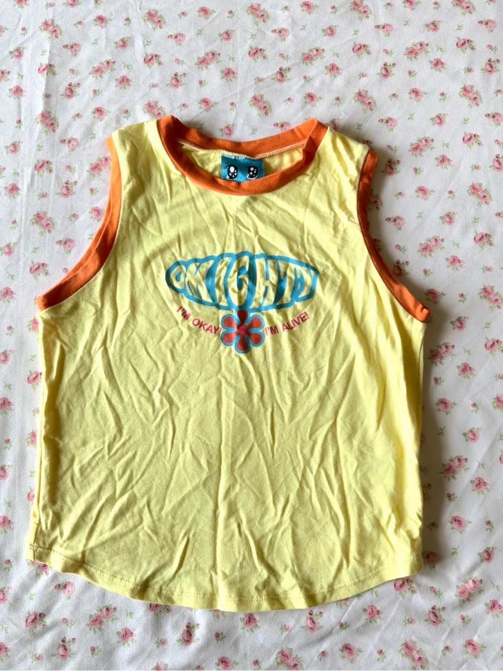 omighty Yellow Tank with Orange Trim and Blue Logo